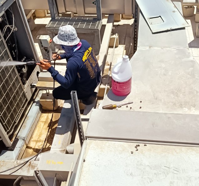 AC technician servicing unit in Dubai